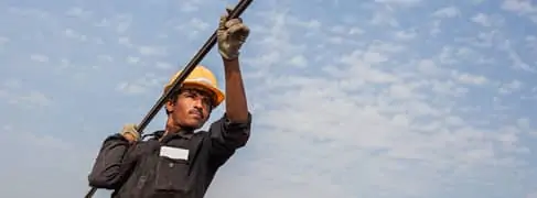 Image of man holding pole
